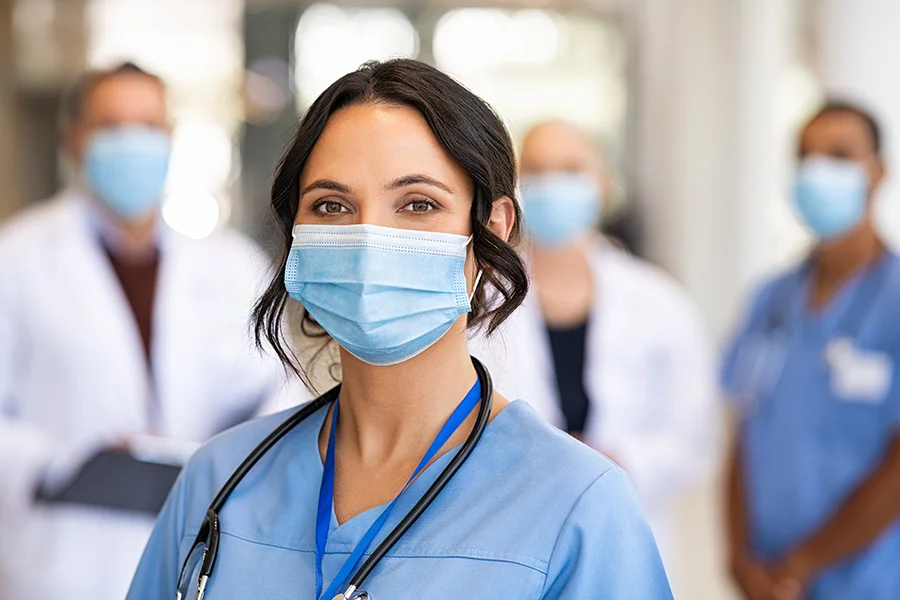 Health care workers wearing face masks