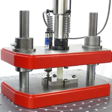 Image of compression fixture for ASTM D695 rigid plastics compression testing