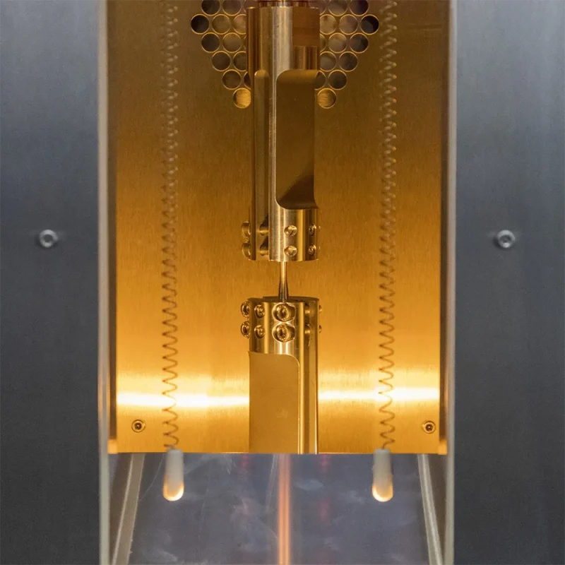 environmental-chamber-and-fatigue-grip-sample Sample and fixture in environmental chamber during fatigue testing