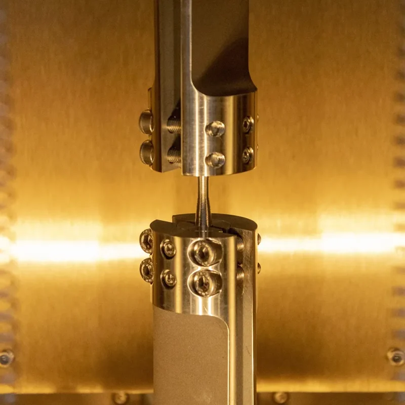 environmental-chamber-and-fatigue-grip-sample-closeup Closeup of sample inside environmental chamber during fatigue test
