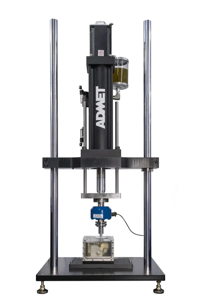eXpert 5950 test machine with ISO 14801 test fixture mounted holding a dental implant sample