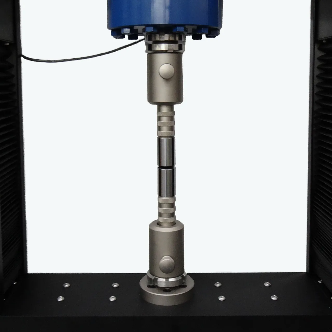 ASTM C633 test fixture