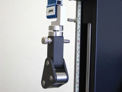 Close up of floating roller fixture for ASTM D3167 testing
