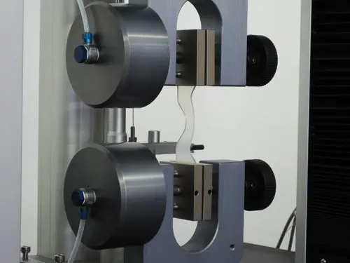 Close up image of pneumatic grips holding sample