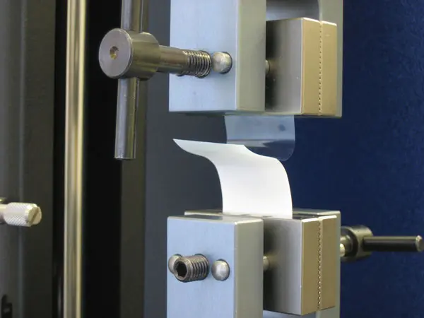 Image of 90-degree peel sample in vise grips