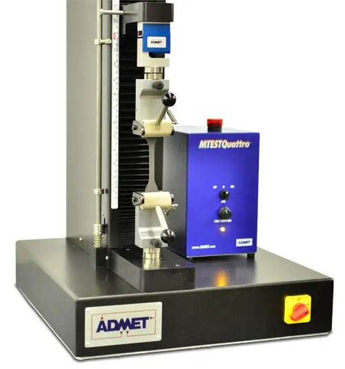 Image of eXpert 7600 and eccentric roller grips holding elastomer sample for ISO 37 testing