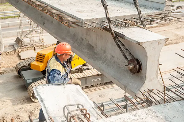 Image of a worker next to a large concrete support