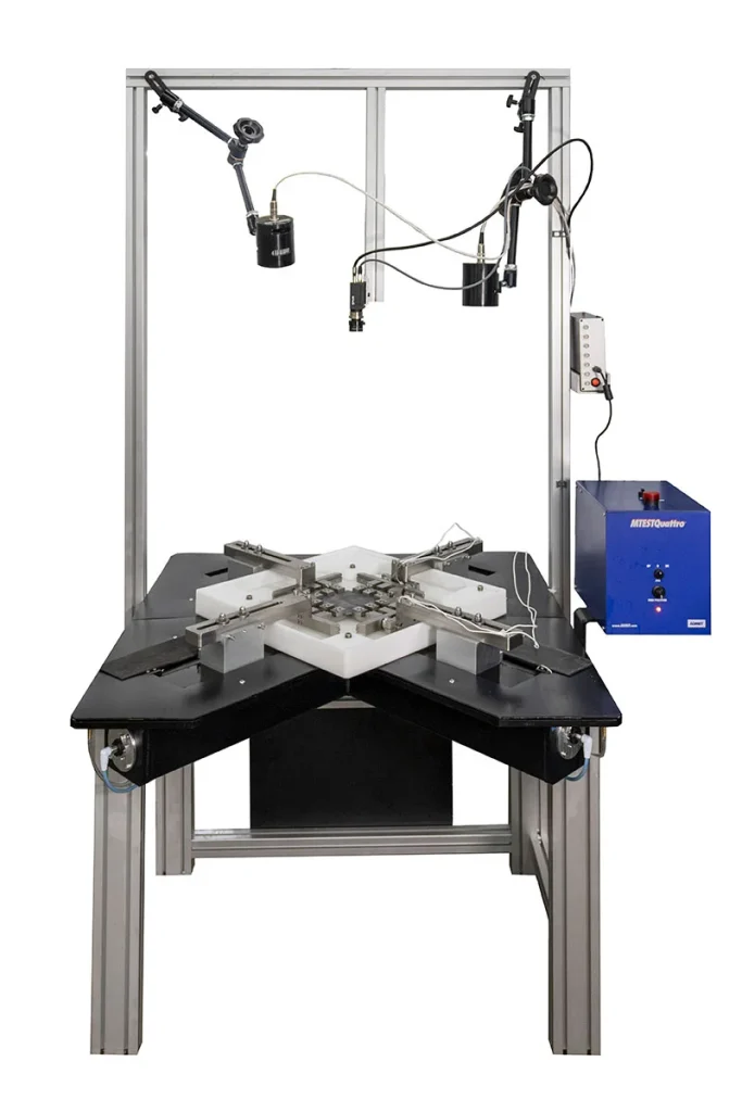 Image of custom planar biaxial system with fluid bath and digital image correlation
