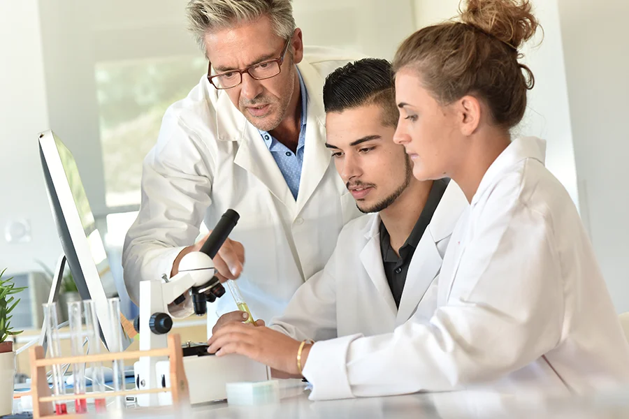 Professor with students in laboratory