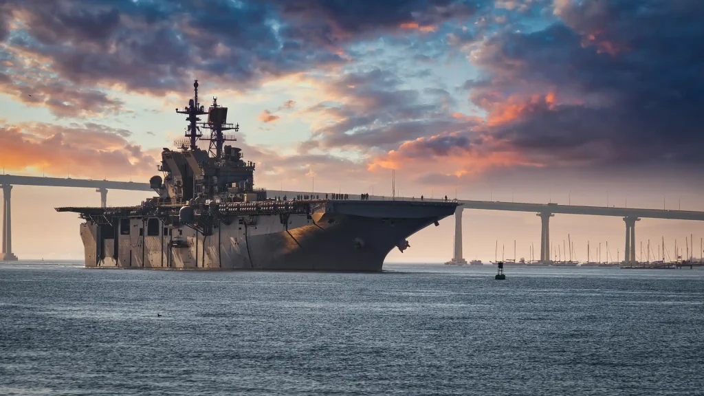 Aircraft carrier against colorful sky
